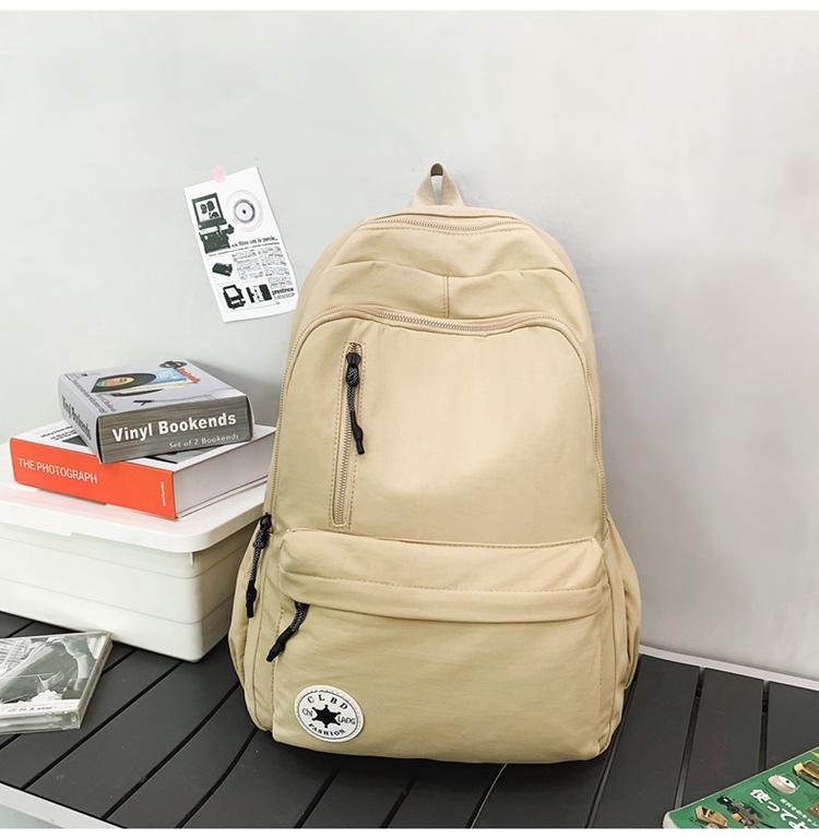 Niche Lightweight Nylon Backpack: Large-Capacity, Casual, Unisex Shoulder Bag for Commuters and Students