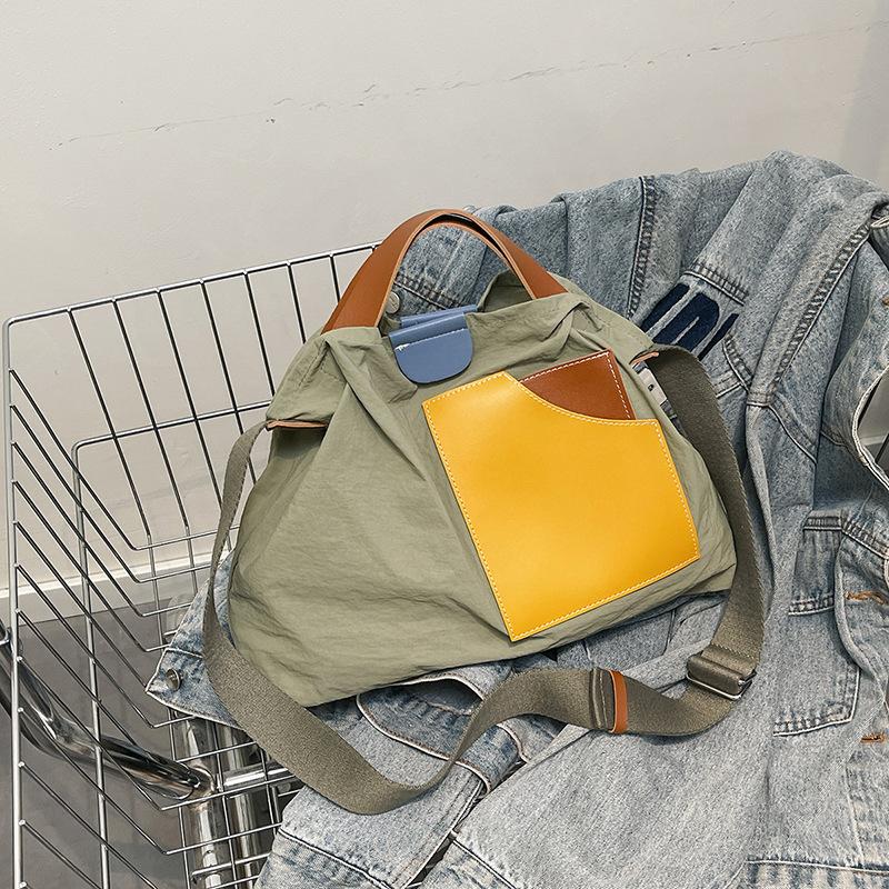 ins niche design splicing canvas bag Korean version women's shoulder bag commuter tote bag versatile casual messenger bag