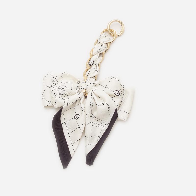 Elegant Hand-Woven Scarf Chain with Bow Decoration Pendant for Bag Strap Modification.
