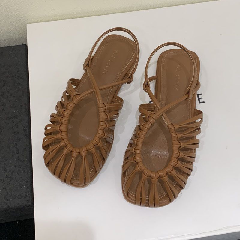 Baotou Roman sandals women's summer 2025 summer new French woven flat-bottomed pig cage shoes fairy strap soft sole