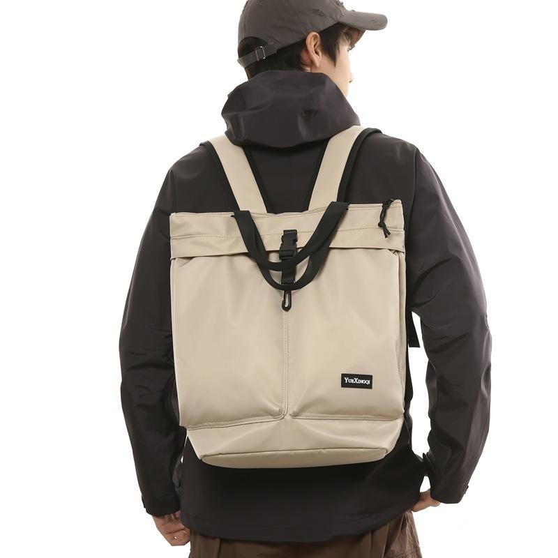 Mochila para Homens e Mulheres para Deslocamento Bolsa de Mão Cor Sólida Casual Bolsa Tote de Ombro Único Grande Capacidade Mochila de Nylon Resistente a Salpicos Moderna