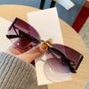 European and American new street photography frameless sunglasses women's hollow metal frames advanced cat glasses sunscreen sunglasses