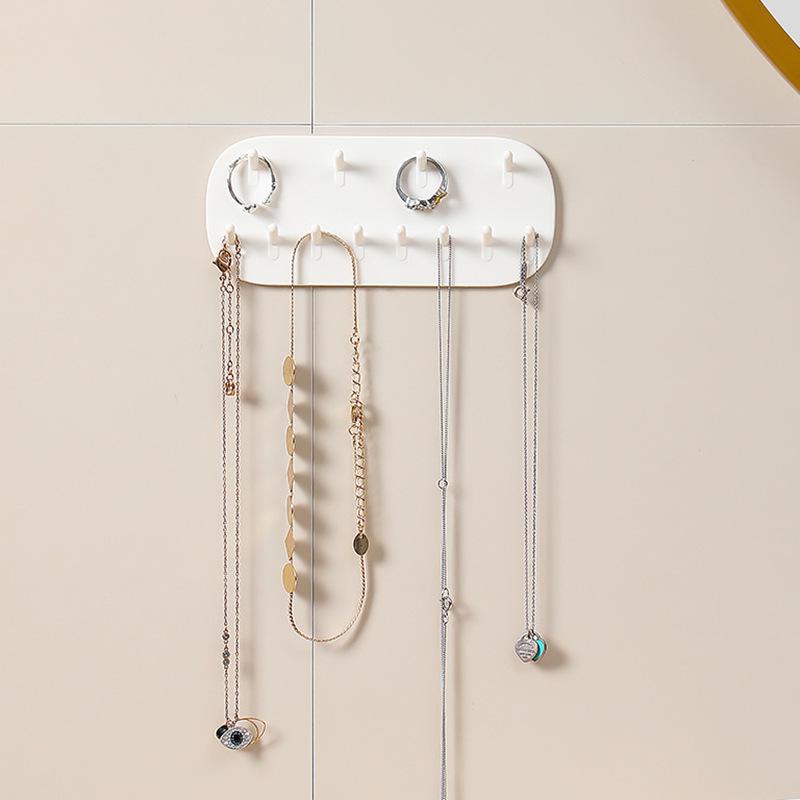 Wall-Mounted Punch-Free Jewelry Hooks: Ring, Earring, Necklace Holder for Home Use with No-Trace Adhesive.