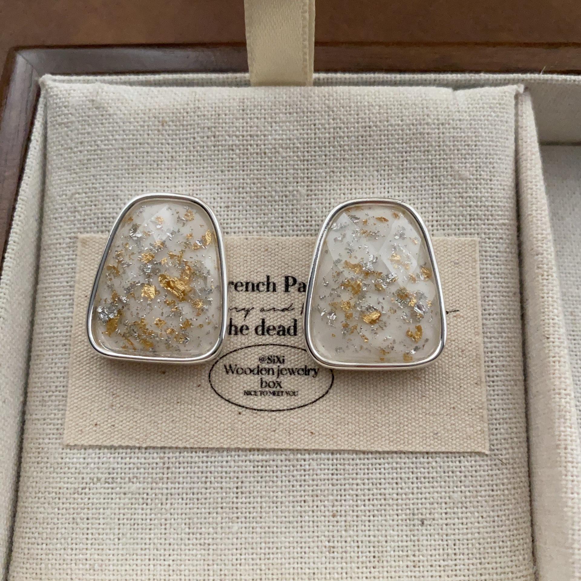 

Square gold foil shredded resin stud earrings women s high sense of art niche fashion romantic personality light luxury earrings