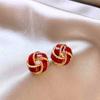 Light luxury high-end French retro concentric knot earrings design temperament versatile New Year's earrings autumn and winter earrings
