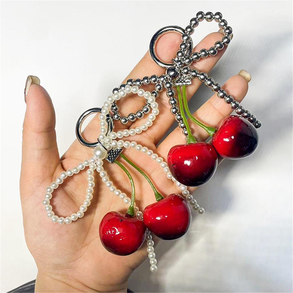 Cherry Pendant Keychain With Bowknot Fashionable Cherry Keychain with Pearlescent Bowknot Accents for Trendsetters