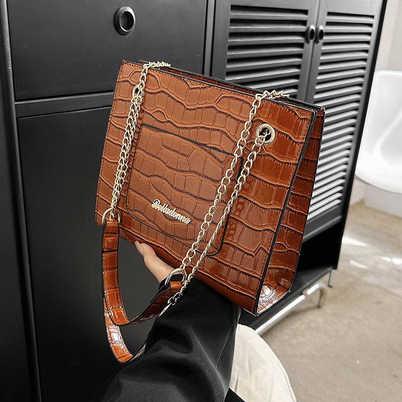 

Large-capacity bag women s 2024 spring new glossy stone pattern shoulder crossbody tote bag Korean version of casual chain bag коричневий
