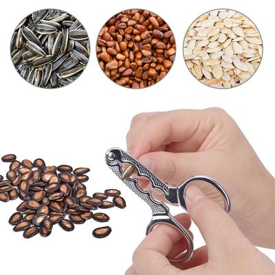1 ADET Alaşım Çok İşlevli Kemirme Kavun Tohumları Ev Aletleri Kavun Tohumu Pense Kabuk Soyma Cihazı Eser Tembel Çam Fıstığı Klipsi Makas Kabuk Soyma