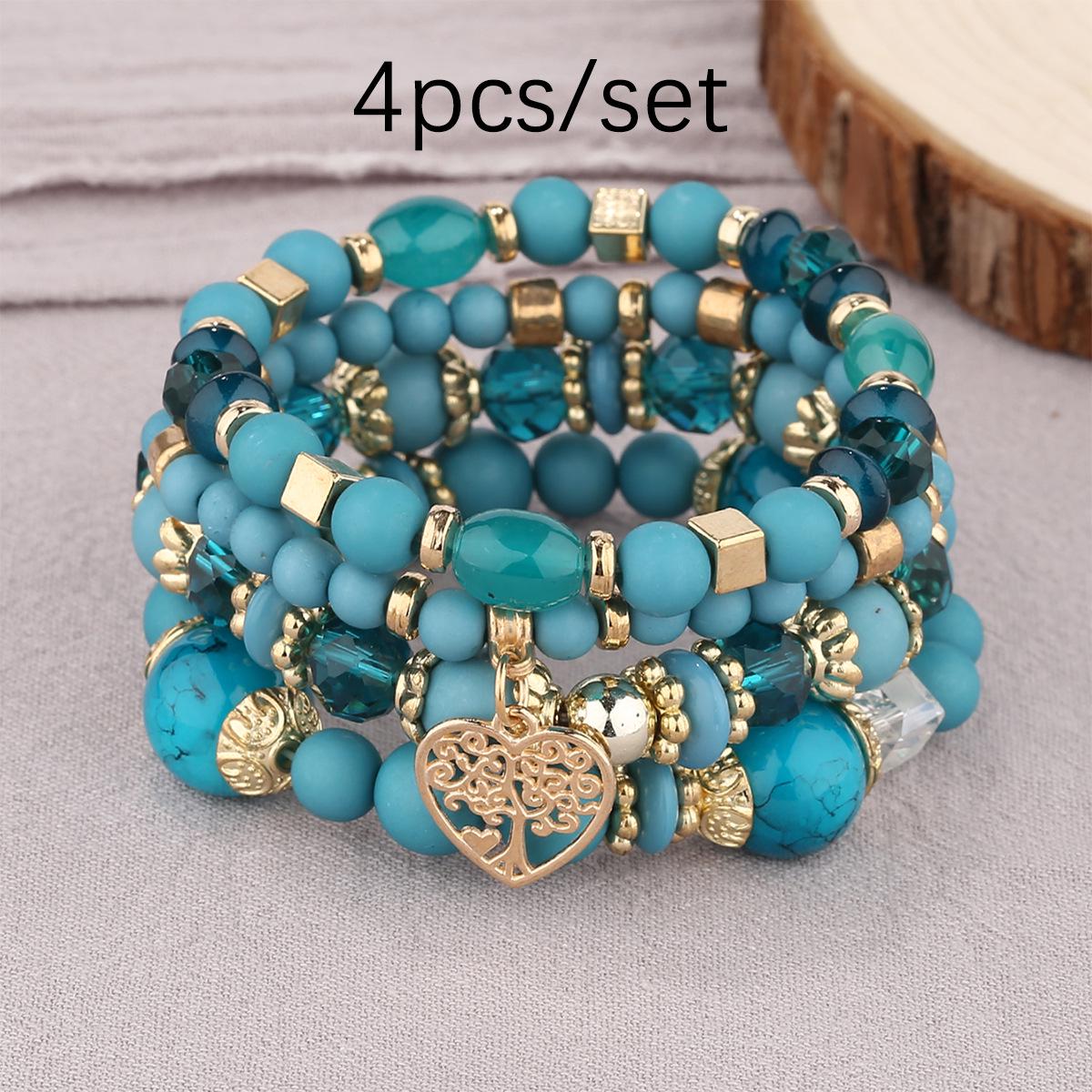 

Многослойный браслет-кисточка в богемном стиле с полыми подвесками в форме сердца и стеклянными бусинами.