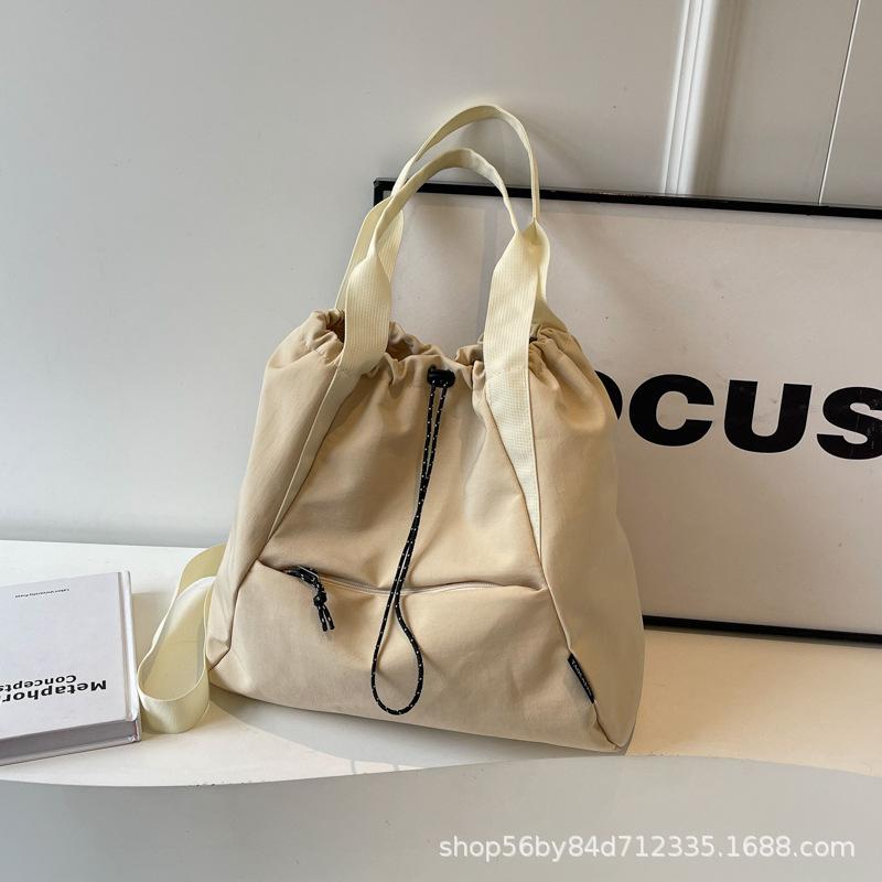 Fashion and leisure large-capacity tote bag women's 2025 spring portable versatile canvas bag multi-pocket shoulder bag