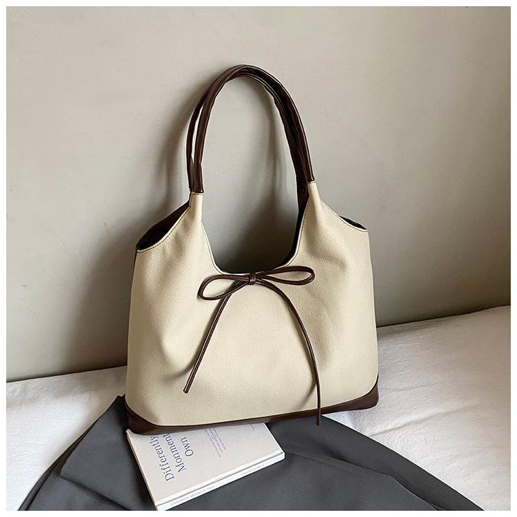 Retro commuter niche bow single shoulder armpit bag 2025 Korean version new fashion simple contrasting color tote bag