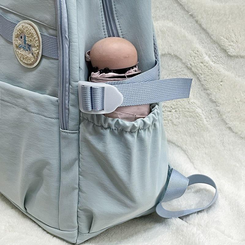 Schoolbag Elementary school bag Female junior high school student Large capacity simple campus backpack College student travel leisure backpack