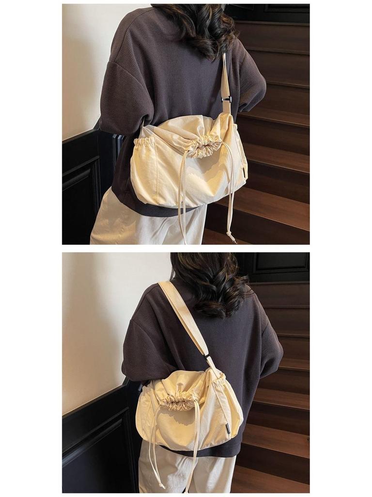 2025 Black Pleated Drawstring Tote - Large Capacity, Versatile Single-Shoulder Crossbody Bag for Casual and Commute Use.