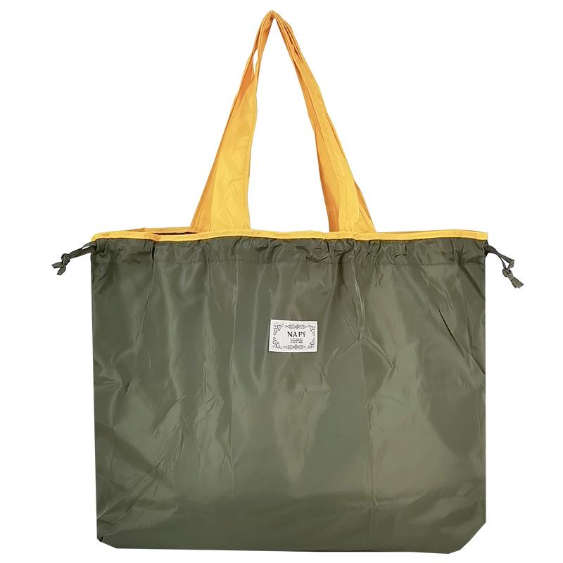 Medium Drawstring Shopping Bag - Portable, Fashionable, Solid Color Tote for Grocery Storage.