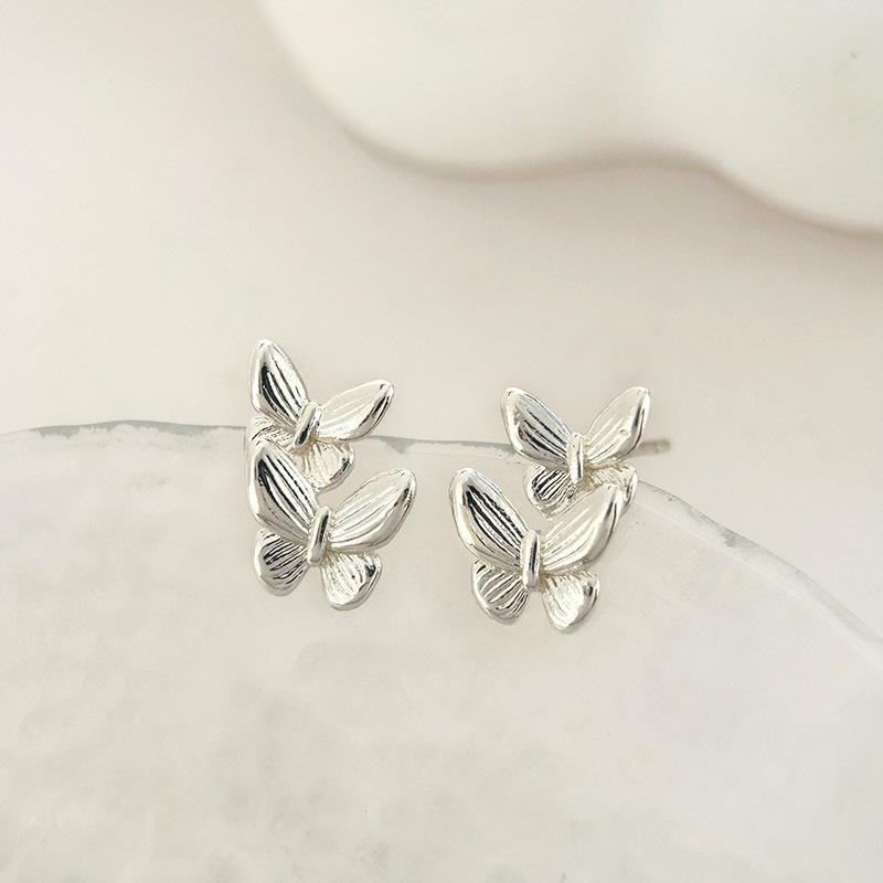 Minimalistische Doppel-Schmetterling-Ohrringe: Elegante High-End Damen-Stecker mit modischem Design