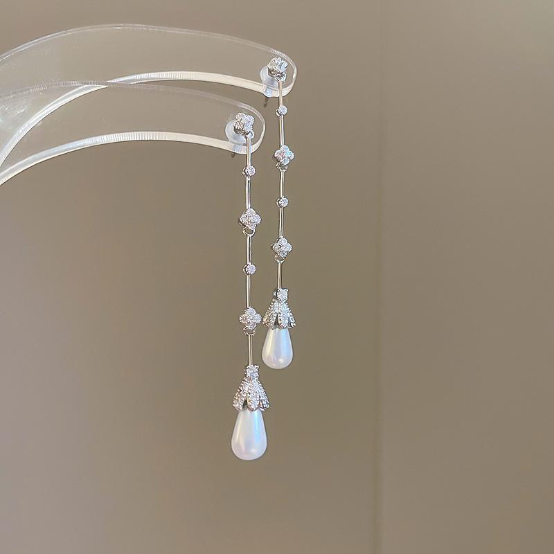 

Циркон жемчуг капля воды серьги с бахромой женская мода простые нишевые темпераментные серьги легкая роскошь высококлассные серьги