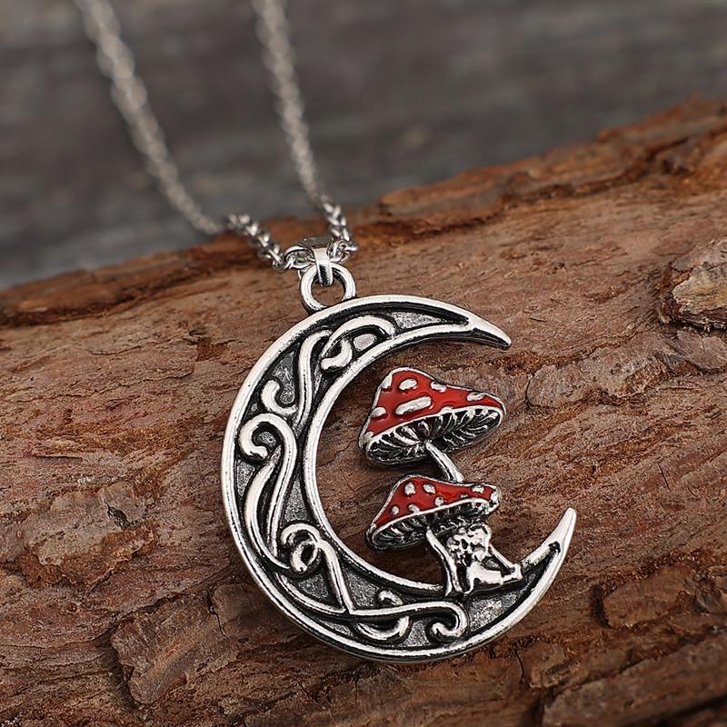 

A stylish and cute red mushroom pendant necklace with a moon and a little girl design, suitable for women s everyday wear.