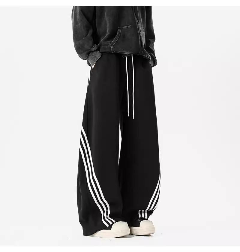 Pánské tmavě modré široké tepláky se třemi pruhy - Ležérní jarní high street trend