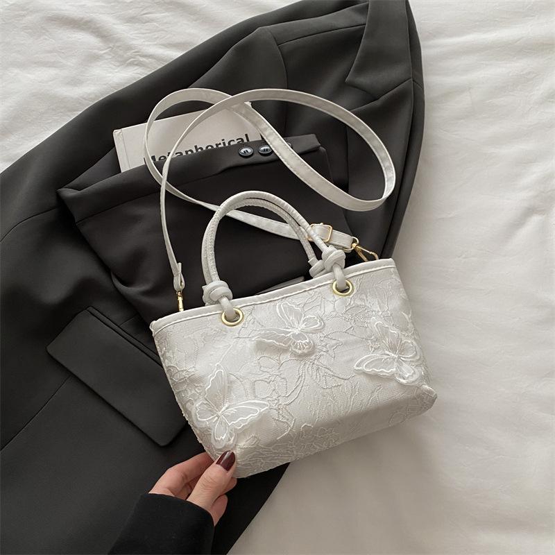 Super fire niche embroidered bag women's 2025 new summer versatile messenger bag fashionable portable bucket bag