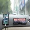 A Universal Mobile Phone Holder Made for Car Dashboards, Featuring a Gravity Automatic Clamping Mechanism, Compatible with Smartphones