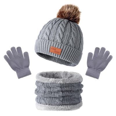 Europäisches und Amerikanisches Kinderstrickmützen-, Schal- und Handschuhset mit Bommel für Herbst und Winter