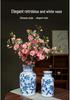 Blue & White Hand-Painted Porcelain Vase: Elegant Ceramic Ornament for Living Room or Entryway.