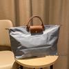 Xiangjia Large-Capacity Waterproof Oxford Travel Tote Bag, Lightweight and Foldable.