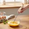Aufhängbarer Manueller Handmixer Tragbarer Edelstahl-Schneebesen Halbautomatischer Dreh-Schneebesen Küche