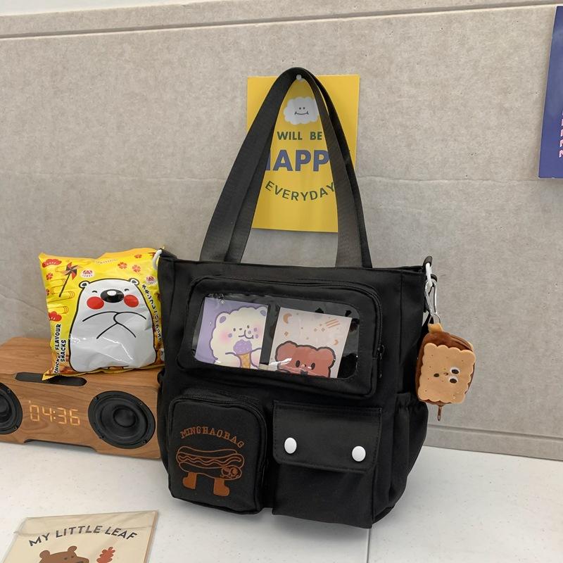 

Нишевый дизайн Высокая ценность Японская милая сумка-тоут для репетиторства Большая вместимость Студенческая сумка для класса Сумка через плечо