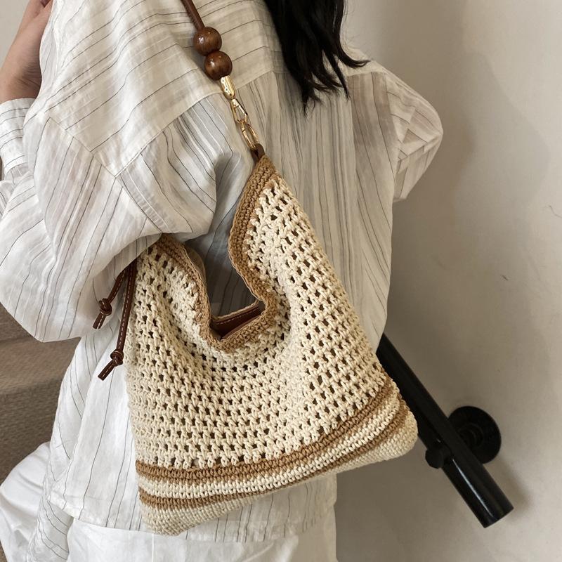 Tote bag women's 2025 new large-capacity commuter college students in class weaving soft hollow beach shoulder bag