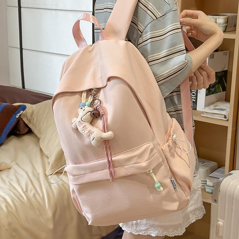 New small fresh schoolbag, high-capacity solid-color backpack for junior high school girls, high-value backpack for primary school students