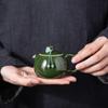 Emerald Green Ceramic Xishi Teapot - Handmade Single Person Kung Fu Tea Set with Anti-Scald Grip and Infuser.