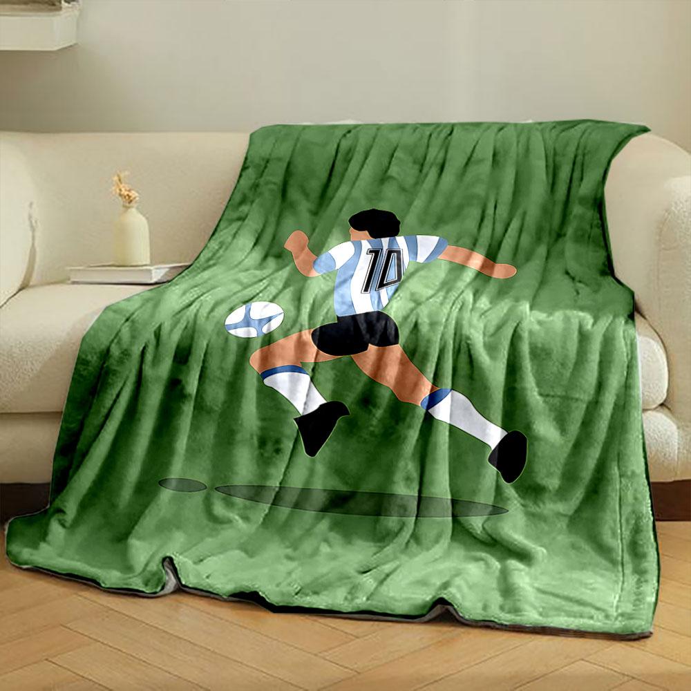 Illustration of a soccer player wearing stripes chasing a ball on a green field. for all seasons blanket lunch break throw gift