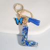 1pc Custom Blue Alphabet Letter Keychain with Butterfly Pendant Resin Ladies Key Ring with Tassel - Elegant Accessory for Bags Backpacks