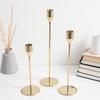 Elegant European Candle Holder Set: Electroplated Three-Piece Metal Ornament for High-End Dining and Wedding Décor.