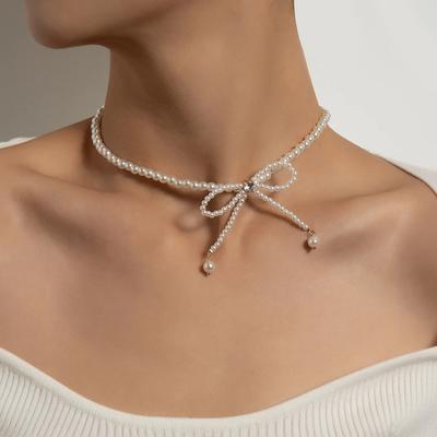 Colares elegantes de zircônia com laço para mulheres, colares de gargantilha com laço de pérolas de imitação, colar com pingente de borla com laço requintado