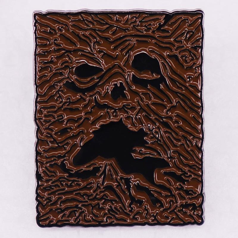 

Horror Transformation Necronomicon Enamel Pin