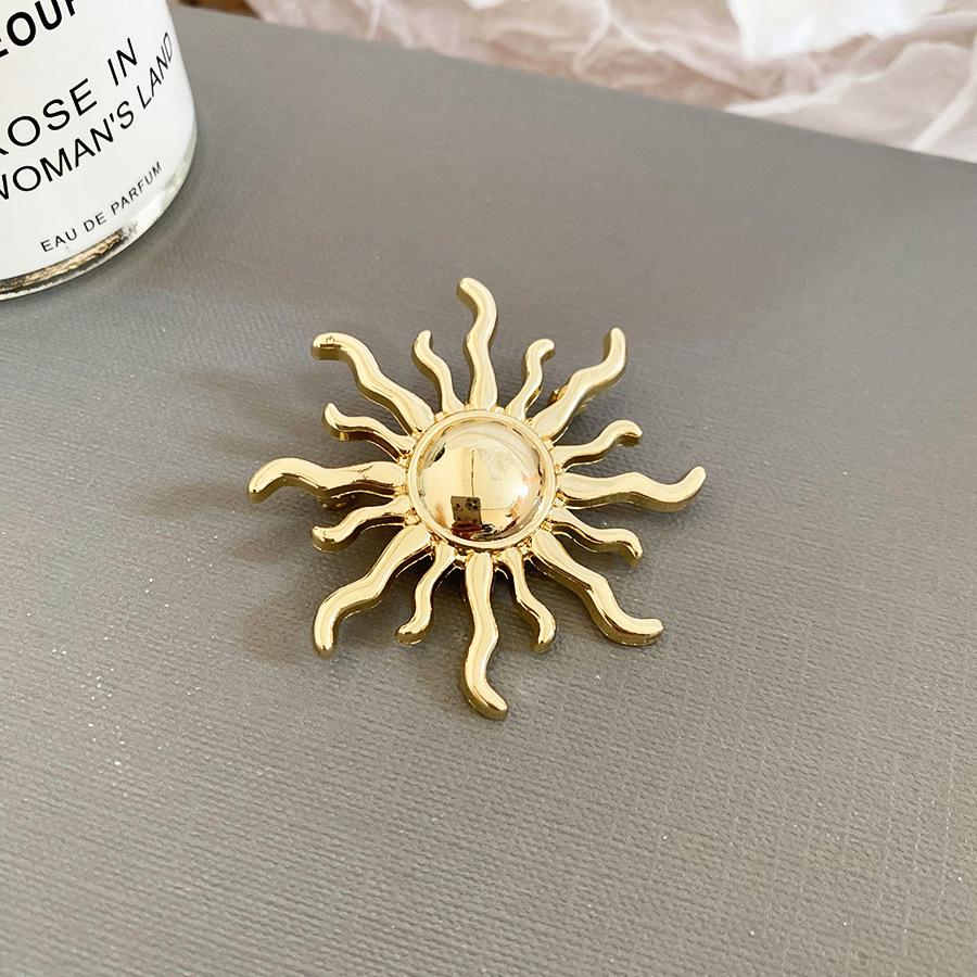 Metallische Blatt-Sonnen-Geometrische Brosche: Eleganter High-End Mode-Anstecker für Damen