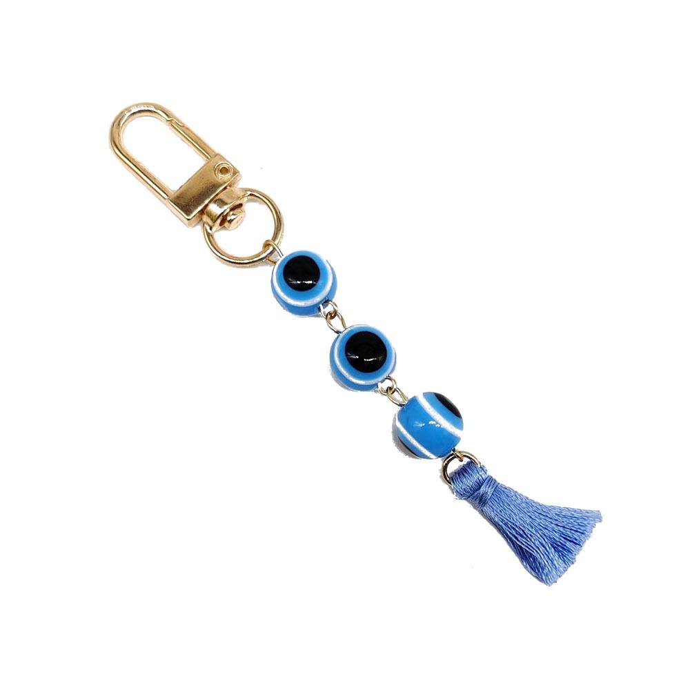 

Turkish Resin Eye Keychain with Gold-Plated Tassel Pendant небо синє кольору