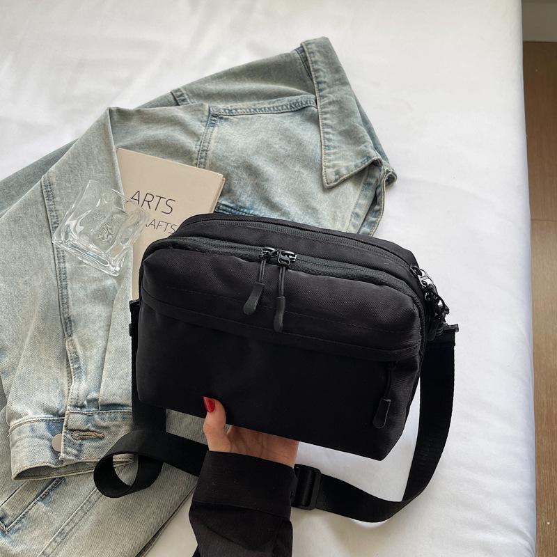 Mobile phone bag simple trend 2025 summer new Japanese lightweight shoulder small backpack women's leisure sports messenger bag