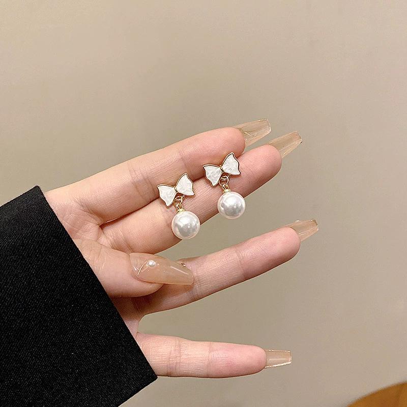 Annual explosion Pearl butterfly earrings women's high-end sense niche 925 silver needle earrings ear jewelry wholesale
