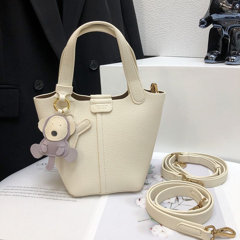 

Доступная роскошь Kangkangjia Сумка-ведро в западном стиле из мягкой кожи с узором личи Rice White(White pendant random)