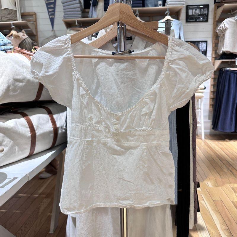 

Веб-сайт Кружевные топы на трех пуговицах Женский стиль чистого желания V-образный вырез Рукава-буфы BM Чистый хлопок С короткими рукавами Контролирующий талию Приталенная футболка Лето White All yards