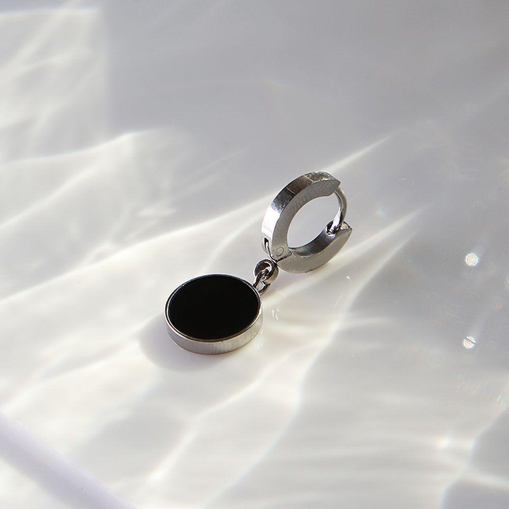 

Surgical piercing black round ring piercing