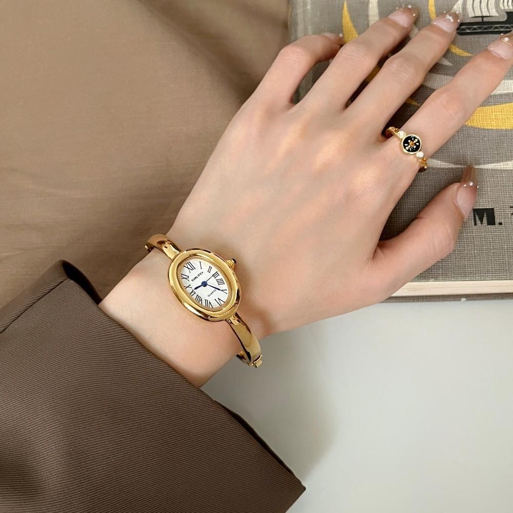 Dámské křemenné hodinky Luxusní římské číslice Reloj Minimalistické Jednoduché Oválné hodiny Dámské Nerezová ocel Orologio Zlaté pouzdro Náramkové hodinky