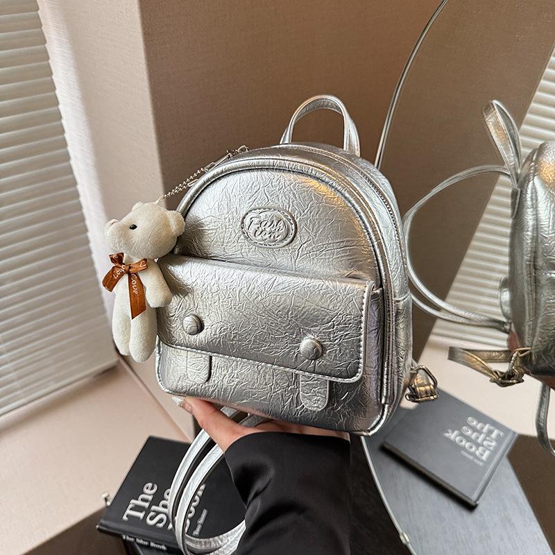 

High sense niche design backpack women s new fashion college student silver hand carry small backpack срібний