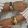 European & American Asymmetrical Glossy Fashion Bracelet with Curved Design