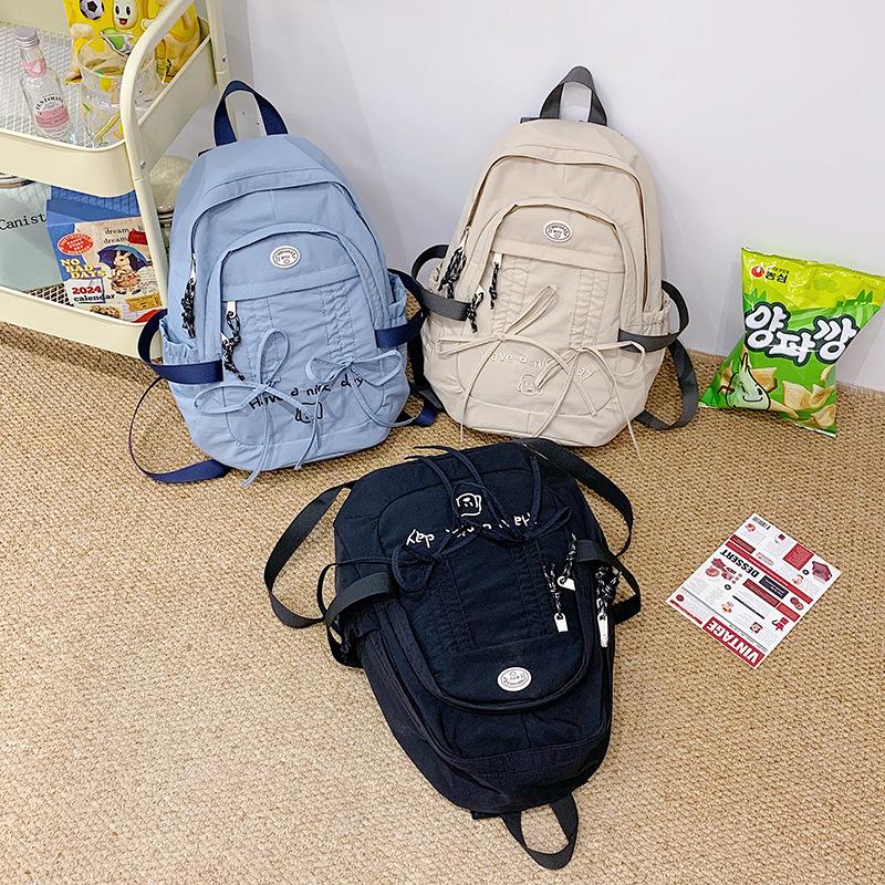 Korean Leisure CampusUse Schoolbag Female BrandNew Cute Large Capacity Nylon Cloth Bag Solid Color Small Fresh Computer Backpack