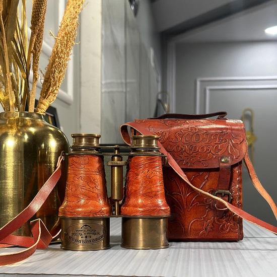 

Стильний помаранчевий шкіряний бінокль вікторіанської морської оптики зі шкіряним футляром