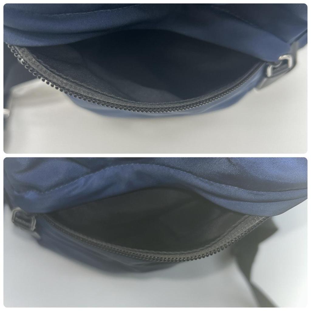 Prada 2VZ135 Stoff Rucksack Reisetasche mit Dreieckslogo Plakette Marine Schwarz Weiß Anhänger Inklusive Aufbewahrungsbeutel